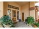 Front entry with wood door and sidelights, offering natural light at 3361 Winery Rd, Pahrump, NV 89048