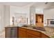 Kitchen with granite counters, double sink and oak cabinets at 3361 Winery Rd, Pahrump, NV 89048