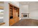 Living room with a built-in entertainment center and a corner fireplace at 3361 Winery Rd, Pahrump, NV 89048