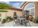 Small patio with a fountain and seating for four people at 3361 Winery Rd, Pahrump, NV 89048