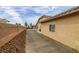 Landscaped side yard with gravel and a paved pathway at 3361 Winery Rd, Pahrump, NV 89048