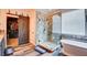 Spa-like bathroom with a soaking tub, walk-in shower, and barn door at 3402 Arcata Point Ave, Las Vegas, NV 89141