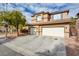 Two-story house with a three-car garage and landscaped front yard at 3402 Arcata Point Ave, Las Vegas, NV 89141