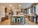 Spacious kitchen with granite island, stainless steel appliances, and farmhouse-style cabinets at 3402 Arcata Point Ave, Las Vegas, NV 89141