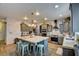 Spacious kitchen with granite island, stainless steel appliances, and farmhouse-style cabinets at 3402 Arcata Point Ave, Las Vegas, NV 89141