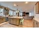 Large kitchen with granite island, stainless steel appliances, and farmhouse-style cabinets at 3402 Arcata Point Ave, Las Vegas, NV 89141