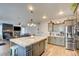 Spacious kitchen with granite island, stainless steel appliances, and modern cabinetry at 3402 Arcata Point Ave, Las Vegas, NV 89141