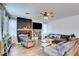 Bright and airy living room featuring a cozy fireplace and hardwood floors at 3402 Arcata Point Ave, Las Vegas, NV 89141