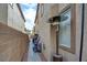 Narrow side yard with stone pavers along the house, showcasing functionality and outdoor space at 3402 Arcata Point Ave, Las Vegas, NV 89141