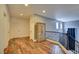 Upstairs hallway with wood flooring, built-in storage, and wrought iron railings at 3402 Arcata Point Ave, Las Vegas, NV 89141