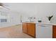 Kitchen with light wood cabinets and a view into the living room at 3425 E Russell Rd # 121, Las Vegas, NV 89120