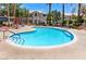 Community pool with surrounding patio furniture at 3425 E Russell Rd # 121, Las Vegas, NV 89120