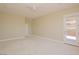 Bedroom featuring neutral colored carpet, ceiling fan, and backyard access at 36 Hunt Valley Trl, Henderson, NV 89052