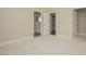 Spacious bedroom with plush carpet, ensuite bathroom, and walk-in closet at 36 Hunt Valley Trl, Henderson, NV 89052