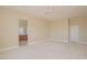 Bedroom featuring neutral colored carpet, ceiling fan, and attached bathroom at 36 Hunt Valley Trl, Henderson, NV 89052