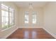 Bright dining room with hardwood floors and large windows at 36 Hunt Valley Trl, Henderson, NV 89052