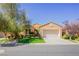 Single-story home with a two-car garage and well-manicured lawn at 36 Hunt Valley Trl, Henderson, NV 89052