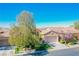 Single-story home with attached garage and mature tree at 36 Hunt Valley Trl, Henderson, NV 89052