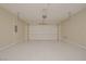 Clean two car garage with epoxy floors and automatic door opener at 36 Hunt Valley Trl, Henderson, NV 89052