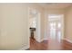 Elegant hallway with hardwood floors leads to the kitchen and a bright, open living space at 36 Hunt Valley Trl, Henderson, NV 89052