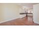 Open-concept kitchen with white cabinets and hardwood floors at 36 Hunt Valley Trl, Henderson, NV 89052