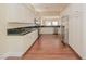 Modern kitchen with white cabinets and dark countertops at 36 Hunt Valley Trl, Henderson, NV 89052