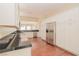 Modern kitchen with stainless steel appliances, black granite counters, and white cabinets at 36 Hunt Valley Trl, Henderson, NV 89052