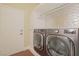 Laundry room with modern LG washer and dryer set at 36 Hunt Valley Trl, Henderson, NV 89052