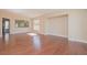 Spacious living room with hardwood floors and large windows showcasing plenty of natural light at 36 Hunt Valley Trl, Henderson, NV 89052