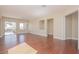 Open living space with hardwood flooring and view to outdoor patio at 36 Hunt Valley Trl, Henderson, NV 89052