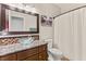 Bathroom with glass sink, granite countertop and tiled shower at 3801 Terrace Grove St, Las Vegas, NV 89129