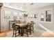 Bright dining room with wood table and a chandelier at 3801 Terrace Grove St, Las Vegas, NV 89129