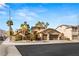 Beautiful home exterior with landscaped yard and driveway at 3801 Terrace Grove St, Las Vegas, NV 89129