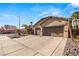 Two-car garage and manicured landscaping at 3801 Terrace Grove St, Las Vegas, NV 89129