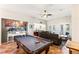 Spacious game room with pool table and views into the kitchen and backyard at 3801 Terrace Grove St, Las Vegas, NV 89129