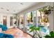 Sunroom with terracotta tile floor and sliding glass doors to pool at 3801 Terrace Grove St, Las Vegas, NV 89129