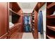 Spacious walk-in closet with custom wood shelving and drawers at 3801 Terrace Grove St, Las Vegas, NV 89129