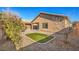 Landscaped backyard with artificial turf and gravel at 4039 Welsh Pony St, Las Vegas, NV 89122