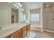 Elegant bathroom featuring double sinks and a soaking tub at 4039 Welsh Pony St, Las Vegas, NV 89122