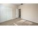 Well-lit bedroom with double door closet and carpet floors at 4039 Welsh Pony St, Las Vegas, NV 89122