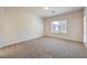 Spacious bedroom with neutral carpeting and backyard access at 4039 Welsh Pony St, Las Vegas, NV 89122