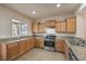 Well-equipped kitchen, featuring granite countertops and ample cabinetry at 4039 Welsh Pony St, Las Vegas, NV 89122