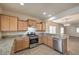 Modern kitchen with granite counters and stainless steel appliances at 4039 Welsh Pony St, Las Vegas, NV 89122