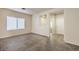 Open living room with neutral colors and tiled floors at 4039 Welsh Pony St, Las Vegas, NV 89122