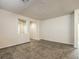 Large living room with neutral walls and tiled floors at 4039 Welsh Pony St, Las Vegas, NV 89122