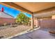 Covered patio overlooking a brick paved backyard at 4039 Welsh Pony St, Las Vegas, NV 89122