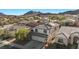 Overhead view of a lovely two-story home with a tile roof in a well-maintained neighborhood near mountains at 41 Voltaire Ave, Henderson, NV 89002