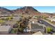 Scenic aerial view of the community showcasing homes with lush landscaping and mountain views at 41 Voltaire Ave, Henderson, NV 89002