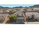 Aerial view of a cozy two-story house with tile roof nestled in a beautiful neighborhood with mountain views at 41 Voltaire Ave, Henderson, NV 89002