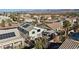 Aerial view of a home with a pool, spa, covered patio, gazebo, and solar panels at 41 Voltaire Ave, Henderson, NV 89002